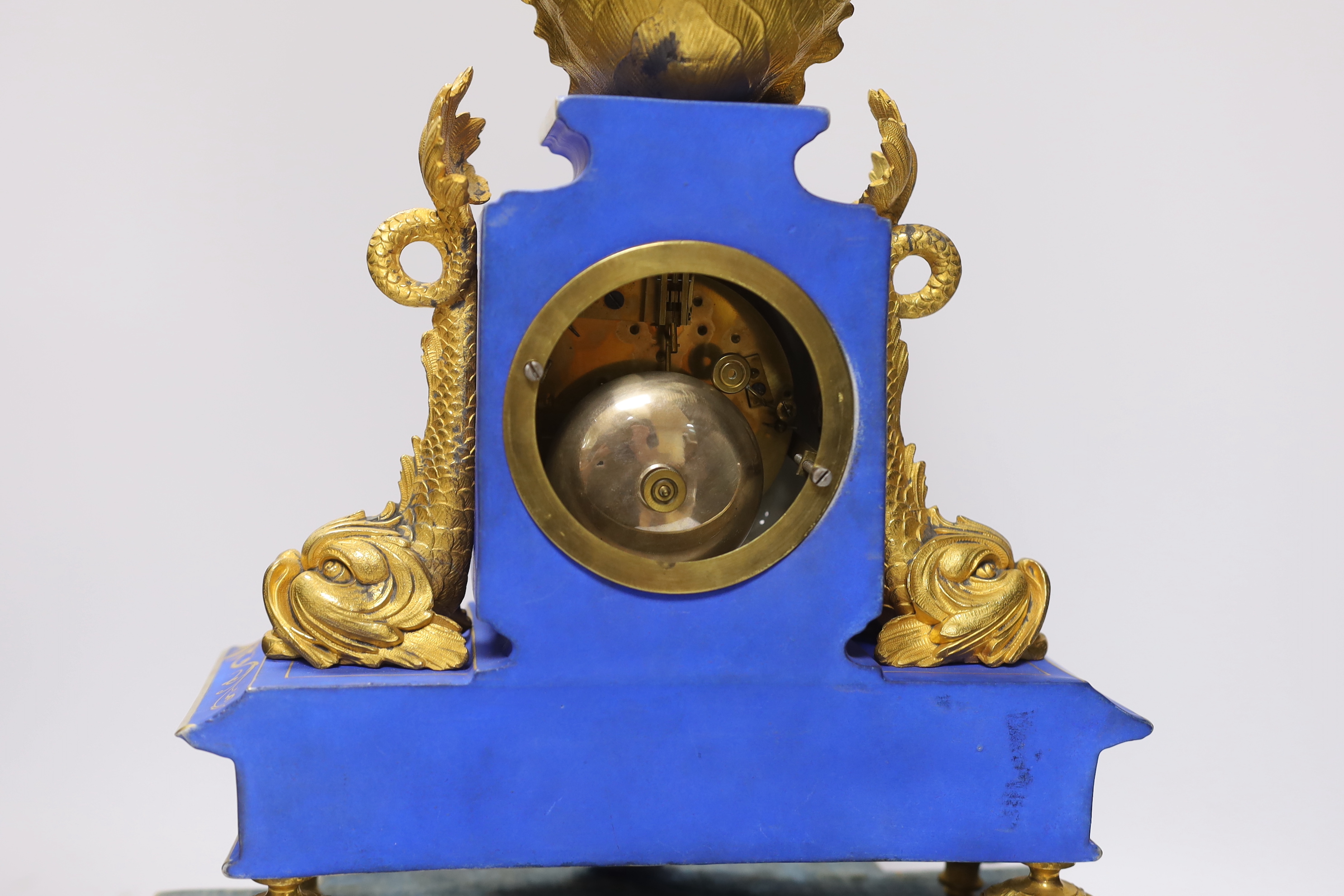 A 19th century French porcelain and gilt mantel clock under glass dome, striking on a bell, the face signed Muller, 48cm high, under dome